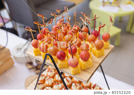 Different types of canapes on buffet table. Different types of canapes on buffet table. 85552320