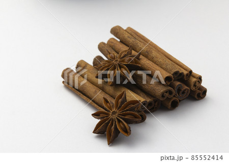 cinnamon sticks and anise stars on white background, healthy eating, copy space, horizontal 85552414
