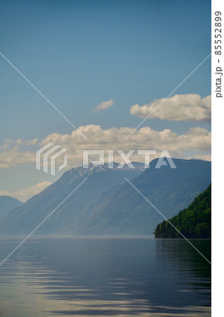 View of lake Teletskoye and the surrounding mountains from the village of Artybash. Turochaksky district, Altai Republic, South of Western Siberia, Russia. 85552899