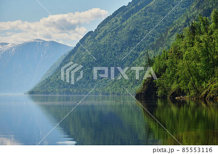 Landscape with boats in the water lake with views of the mountains. Teletskoye Lake Altai in Siberia. Landscape with boats in the water lake with views of the mountains. Teletskoye Lake Altai in Siberia. 85553116