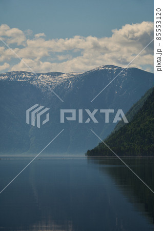 Landscape with boats in the water lake with views of the mountains. Teletskoye Lake Altai in Siberia. Landscape with boats in the water lake with views of the mountains. Teletskoye Lake Altai in Siberia. 85553120