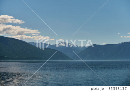 Landscape with boats in the water lake with views of the mountains. Teletskoye Lake Altai in Siberia. Landscape with boats in the water lake with views of the mountains. Teletskoye Lake Altai in Siberia. 85553137