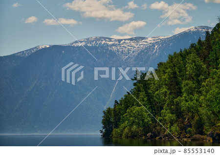 Landscape with boats in the water lake with views of the mountains. Teletskoye Lake Altai in Siberia. Landscape with boats in the water lake with views of the mountains. Teletskoye Lake Altai in Siberia. 85553140