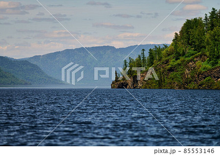 Landscape with boats in the water lake with views of the mountains. Teletskoye Lake Altai in Siberia. Landscape with boats in the water lake with views of the mountains. Teletskoye Lake Altai in Siberia. 85553146