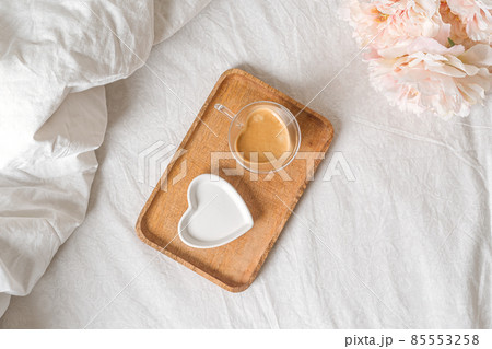 Valentine day lifestyle composition. Still life Mockup scene with plate and cup of coffee. Breakfast in bed. Linen background. Flat lay, top view 85553258
