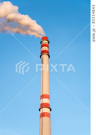 Industrial chimney smoking on sunny winter day Industrial chimney smoking on sunny winter day 85554643