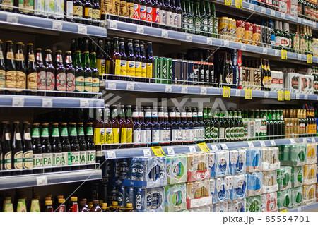 Various kinds of beer in bottles and cans in the supermarket for sale, Moscow, 28 Oct 2021 85554701
