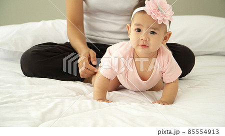 Cute Baby Girl Happy smiling wearing stylish bow on her head Cute Baby Girl Happy smiling wearing stylish bow on her head 85554913