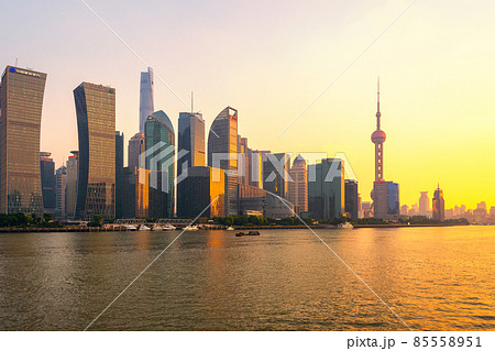 Iconic Lujiazui skyline of Shanghai and the Huangpu River at sunset 85558951