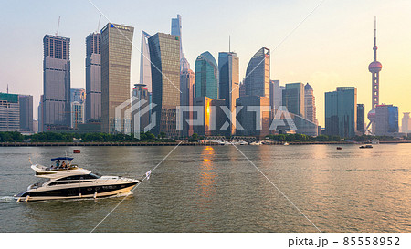 Iconic Lujiazui skyline of Shanghai and the Huangpu River at sunset 85558952