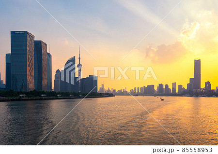 Iconic Lujiazui skyline of Shanghai and the Huangpu River at sunset 85558953
