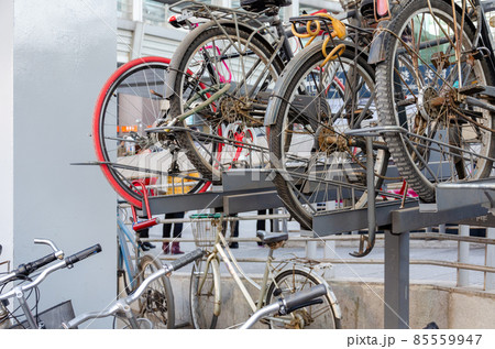 Bicycles stacked at a parking lot near Zhongguancun station of Beijing Subway Bicycles stacked at a parking lot near Zhongguancun station of Beijing Subway 85559947