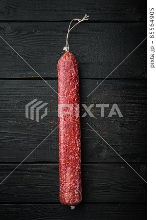 Delicious sausage, on black wooden table background, top view flat lay, with copy space for text Delicious sausage, on black wooden table background, top view flat lay, with copy space for text 85564905