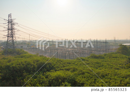 Aerial view of electricity generating, voltage poles. Power lines on utility tower and cable wires in energy electric technology, network, and industry. Generator pylon. Transmission and substation. Aerial view of electricity generating, voltage poles. Power lines on utility tower and cable wires in energy electric technology, network, and industry. Generator pylon. Transmission and substation. 85565323