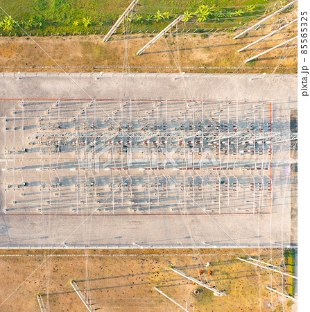 Aerial view of electricity generating, voltage poles. Power lines on utility tower and cable wires in energy electric technology, network, and industry. Generator pylon. Transmission and substation. Aerial view of electricity generating, voltage poles. Power lines on utility tower and cable wires in energy electric technology, network, and industry. Generator pylon. Transmission and substation. 85565325