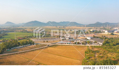 Aerial view of electricity generating, voltage poles. Power lines on utility tower and cable wires in energy electric technology, network, and industry. Generator pylon. Transmission and substation. Aerial view of electricity generating, voltage poles. Power lines on utility tower and cable wires in energy electric technology, network, and industry. Generator pylon. Transmission and substation. 85565327