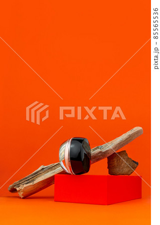 Cosmetic face BB cream tonal foundation glass jar mockup natural wood podium orange background. Balancing makeup product 85565536
