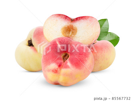 Ripe chinese flat peach fruit isolated on white Ripe chinese flat peach fruit isolated on white 85567732