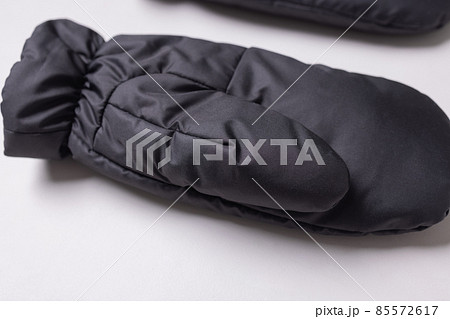 Winter knitted woolen gloves on isolated white background. Winter knitted woolen gloves on isolated white background. 85572617