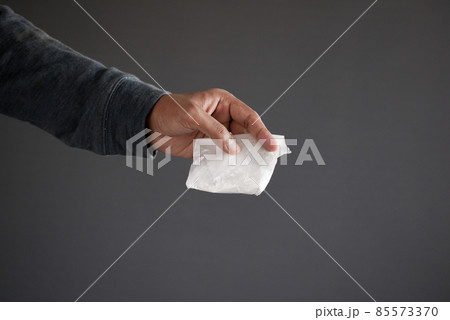 drug addiction concept with hand holding heroine packet on black backgrund drug addiction concept with hand holding heroine packet on black backgrund 85573370
