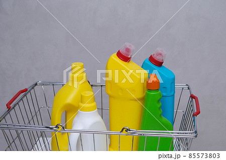 Purchase of household chemicals. Plastic bottles of household chemicals in the shopping basket. 85573803
