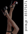 Beautiful legs of an young woman, in fishnet stockings 85575471