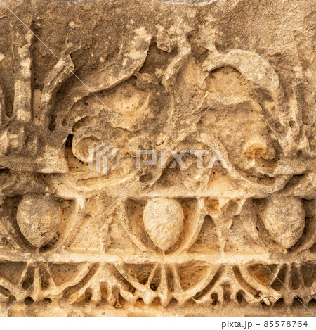 half-erased stone-cut pattern on the ruins of a building in the ancient city of Myra, Turkey 85578764