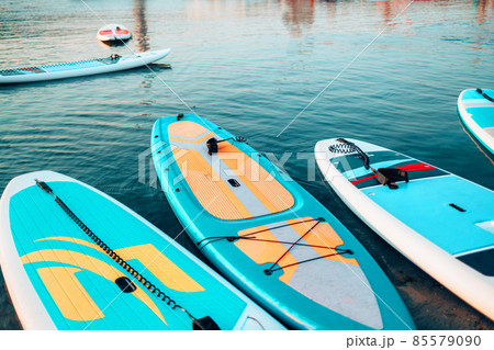 SUP Stand up paddle board on the background blue water. 85579090