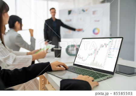 Businesswoman in analyze stock market data using laptop computer proficiently 85585503
