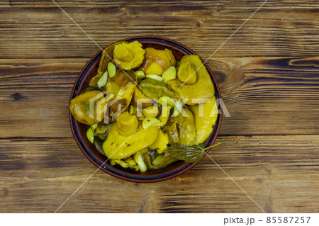 Tasty marinated mushrooms on wooden table. Top view 85587257
