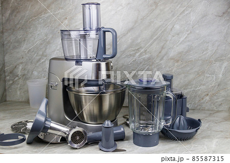Modern kitchen machine with different attachments and accessories Modern kitchen machine with different attachments and accessories 85587315