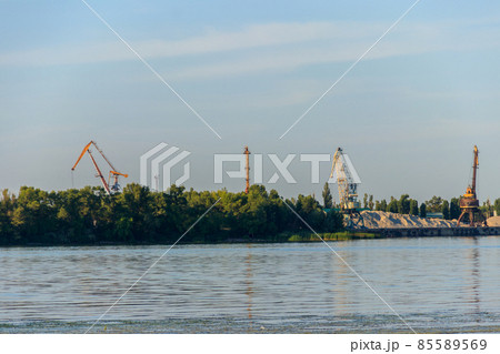 Hoisting cranes at cargo port on the Dnieper river in Kremenchug, Ukraine 85589569
