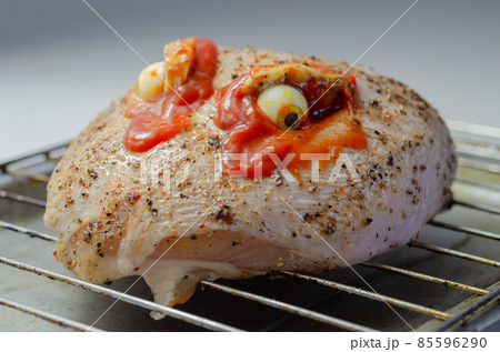 Prepared meat for Halloween party, raw chicken crown with a salt and pepper seasoning and peppercorn butter 85596290