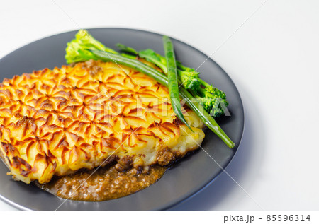 Tender minced lamb with garden veg in a hearty gravy beneath butter mash, typical Shepherd's pie Tender minced lamb with garden veg in a hearty gravy beneath butter mash, typical Shepherd's pie 85596314