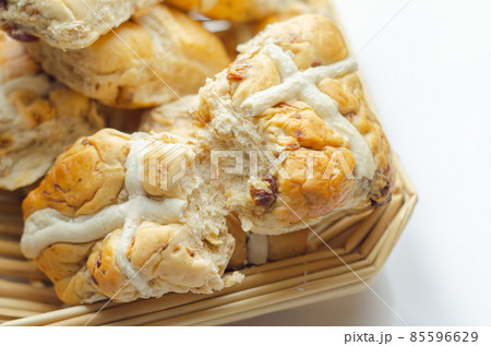 Traditional hot cross buns, bread with characteristic decoration in the shape of a cross Traditional hot cross buns, bread with characteristic decoration in the shape of a cross 85596629