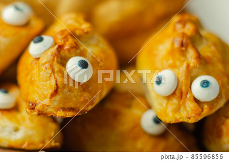 Mini pasties with decorating eyes, succulent pork, turkey, bacon
