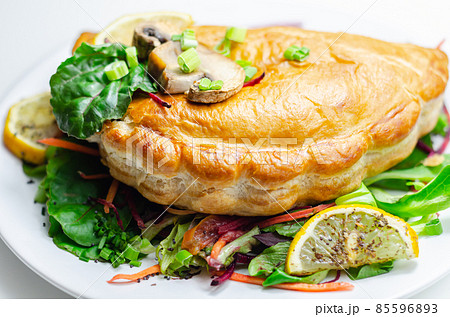 Steak and ale pasty, British steak with ale, potato and leek, wrapped in puff pastry Steak and ale pasty, British steak with ale, potato and leek, wrapped in puff pastry 85596893