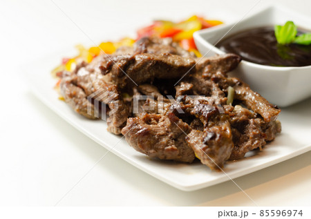 Beef strips with mixed peppers and mangetout served with black bean sauce Beef strips with mixed peppers and mangetout served with black bean sauce 85596974