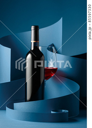 Bottle and glass of red wine. Bottle and glass of red wine. 85597330