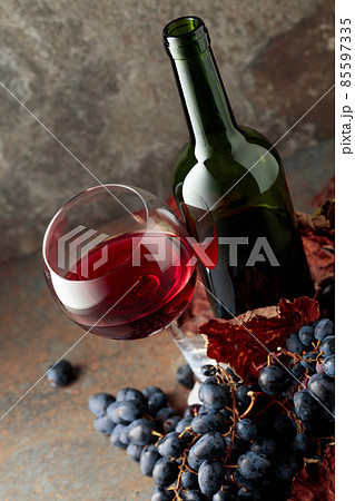 Red wine and blue grapes. Red wine and blue grapes. 85597335