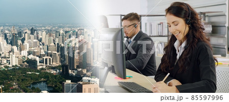 Business people wearing headset working in office broaden view Business people wearing headset working in office broaden view 85597996