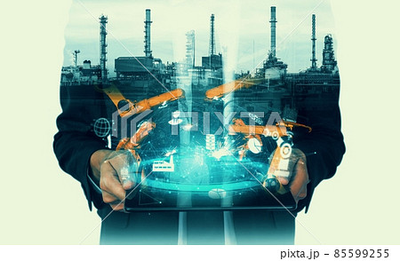 Mechanized industry robot arm and factory worker double exposure 85599255