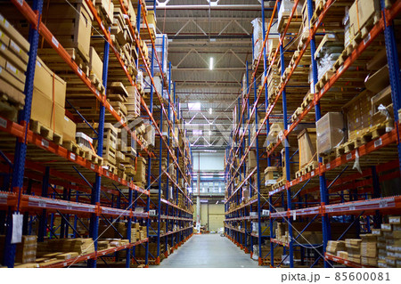Huge distribution warehouse with high shelves and loaders. Huge distribution warehouse with high shelves and loaders. 85600081