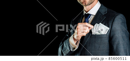 Money stack. Business man hand holding American money. Washington cash, usd background. 85600511