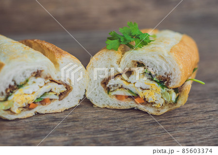 A delicious Vietnamese Bahn Mi sandwich on a wooden background 85603374