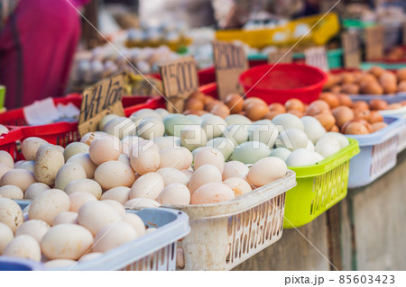 The eggs - chicken and quail in the wicker basket on the Vietnamese market. Asian food concept 85603423
