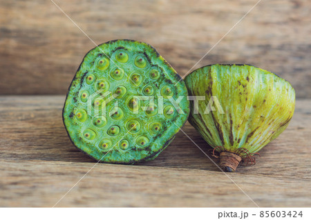 Lotus seeds on an old wooden background 85603424