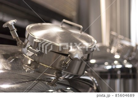 Modern Beer Factory. Steel tanks for beer fermentation and storage. Brewery. Modern beer plant with brewering kettles 85604689