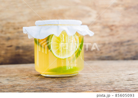 Homemade Fermented Raw Kombucha Tea Ready to Drink With orange and lime. Summer Homemade Fermented Raw Kombucha Tea Ready to Drink With orange and lime. Summer 85605093