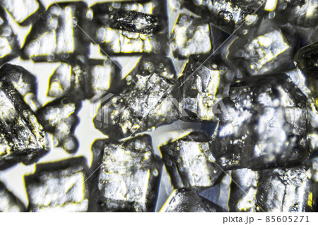 Crystal sugar close up on white background under the light microscope with a magnification of 40 times 85605271